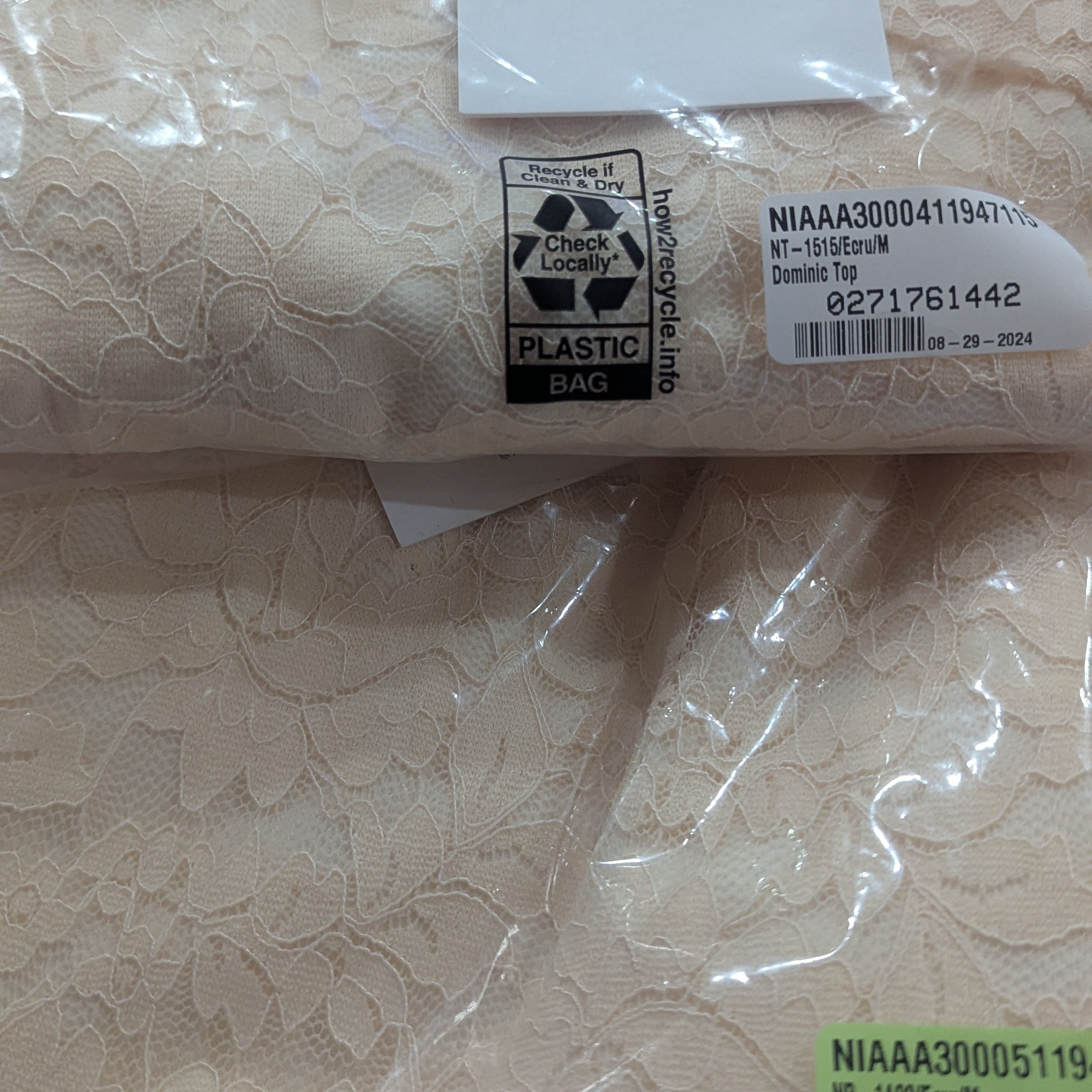 Cream Sleeveless Dress With Textured Design